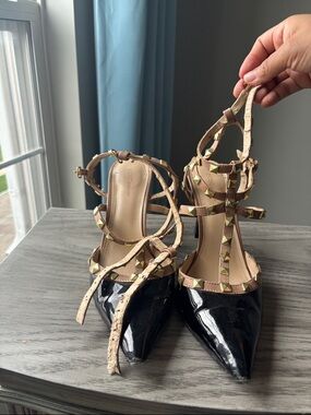 BCBGeneration Black Patent Pointed-Toe T-Strap Heels with Nude Studded Straps